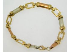 A three colour 9ct gold bracelet, 7.275in long, 7.