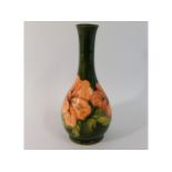 A Moorcroft pottery floral vase, green signature t