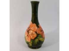 A Moorcroft pottery floral vase, green signature t