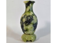 An antique Chinese soapstone vase with carved drag