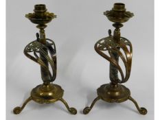 A pair of Victorian brass sabre candle holders, ha