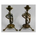 A pair of Victorian brass sabre candle holders, ha