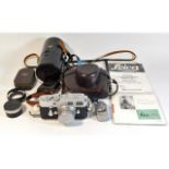 A Leica M3 camera & lens twinned with a Leica ligh