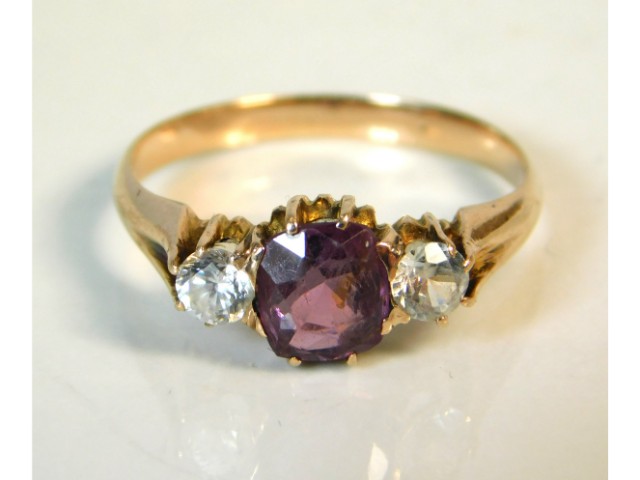 A 9ct gold ring set with amethyst & white stones,