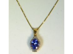 An 18ct gold Illiana tanzanite & diamond pendant with 19.5in long chain, main stone 1.5ct, 2.4g