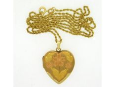 A 14ct gold locket with 17.25in long chain, locket