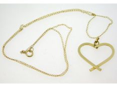 A 9ct gold heart shaped pendant with 17.5in long c