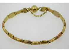 A three colour metal bracelet with magnetic clasp,