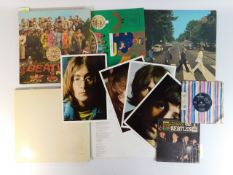 Three Beatles albums: Sergeant Peppers, Parlophone with insert, Abbey Road, Apple, The White Album,
