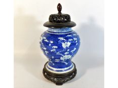 A 19thC. Chinese prunus vase with stand & ill fitting later lid added top, four character mark to ba