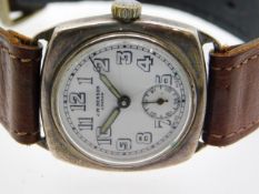 A J. W. Benson silver wrist watch, hairlines to di