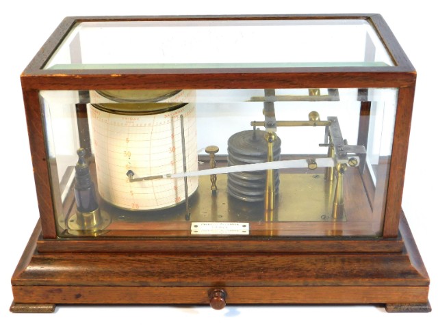 A Negretti & Zamba barograph set within an oak & b