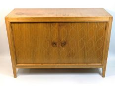 An early 1950's retro Gordon Russell "Double Helix" sideboard designed by David Booth for the 1951 F