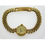 A ladies 9ct gold Omega wrist watch, case diameter 17mm, 6.5in long, 15g, currently running