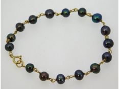 A Tahitian style pearl bracelet with 14ct gold fit