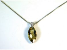 An 18ct gold diamond & yellow csarite pendant with 21mm drop on a 17.5in 18ct gold chain, 3.4g