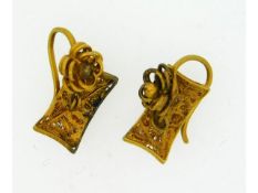 A pair of yellow metal Oriental earrings with flor