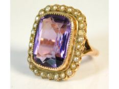 An antique 9ct gold ring set with amethyst & pearl