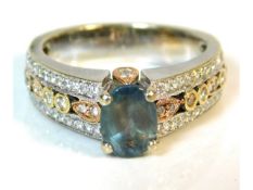 A 14ct white gold ring set with yellow & rose gold