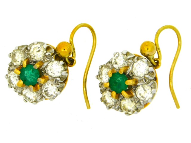 A pair of 18ct gold earrings set with emeralds, approx. 0.84ct diamonds, 3.9g, 8mm diameter