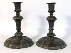 A pair of antique pewter candle holders with inscr