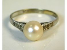 A 9ct white gold ring set with pearl & diamond, 2g