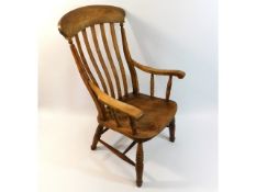 An antique elm seated cut down Windsor armchair, 4