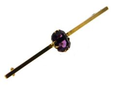 A yellow metal bar brooch set with amethyst, elect