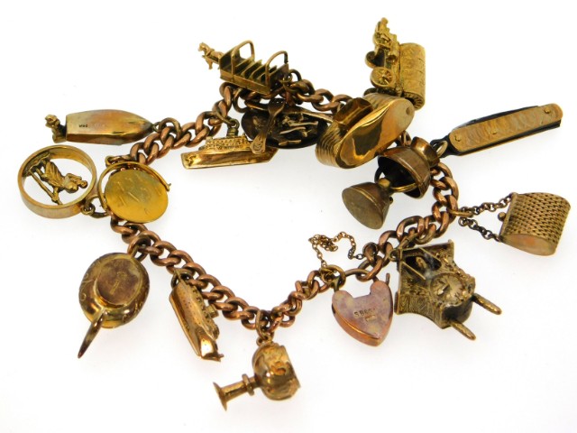 A 9ct gold & yellow metal charm bracelet, camera a