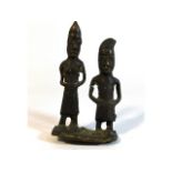 A 19thC. tribal art Benin bronze figure group, dug