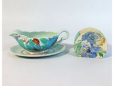 A Clarice Cliff gravy boat & stand twinned with an