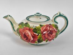 A Wemyss cabbage rose pottery teapot, restoration