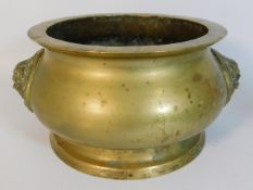 A large antique Chinese bronze censer with lion dog handles, 8in diameter x 5in deep