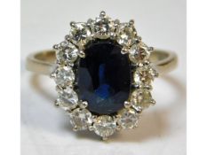 An 18ct white gold diamond & sapphire ring, approx