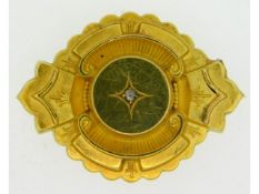 A yellow metal memorial brooch set with diamond, e