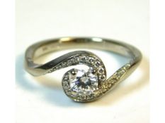 A Canadian Ice Twist Starlight 18ct white gold ring set with 0.35ct centre stone & other smaller dia