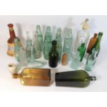 A collection of mostly antique glass bottles including De Kuyper liqueur, Heatherdale Scotch Whisky,