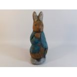 A heavy Peter Rabbit garden ornament/door stopper,