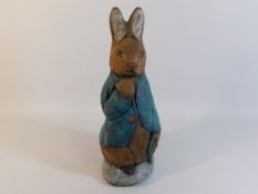 A heavy Peter Rabbit garden ornament/door stopper,