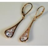 A pair of rose gold plated silver earrings set wit