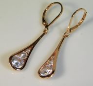 A pair of rose gold plated silver earrings set wit