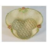 A Belleek woven porcelain basket with roses, one p