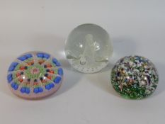 Three decorative paperweights including on Caithne