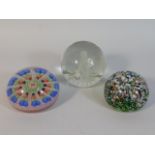 Three decorative paperweights including on Caithne