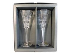 A boxed pair of Waterford crystal champagne flutes