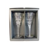 A boxed pair of Waterford crystal champagne flutes