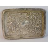 An Edwardian embossed silver tray by Robert Pringl