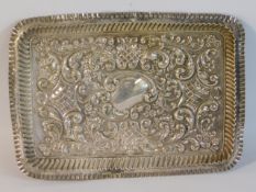 An Edwardian embossed silver tray by Robert Pringl