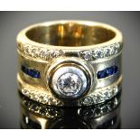 A 9ct gold ring set with collet set diamond & sapp