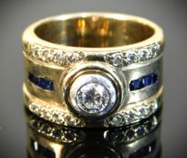 A 9ct gold ring set with collet set diamond & sapp